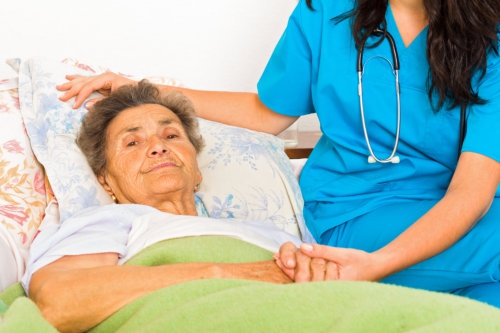 nurse with her patient who has terminal illness disease